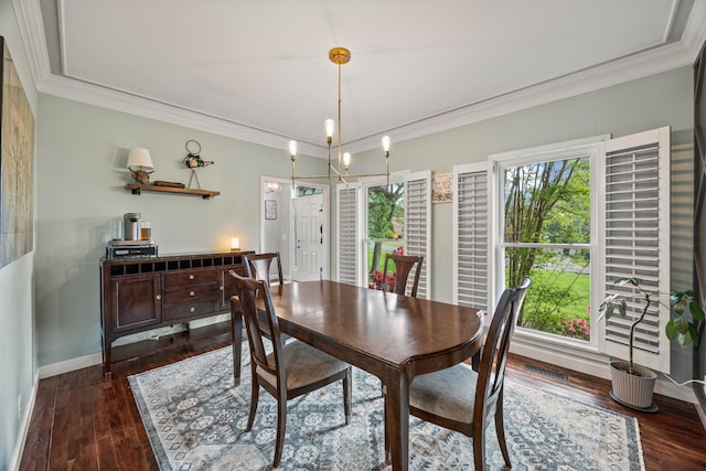 dining area with crown molding, baseboards, dark wood-type flooring, and visible vents