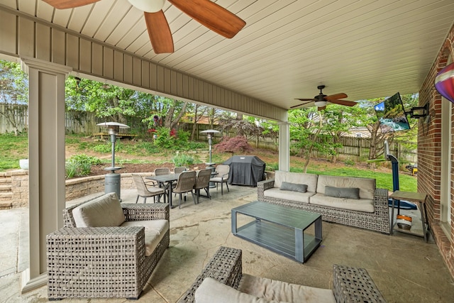 view of patio / terrace with an outdoor hangout area, area for grilling, outdoor dining area, and ceiling fan