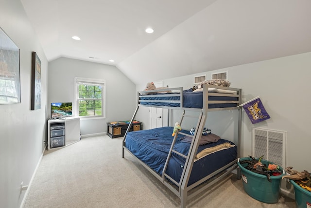 bedroom with carpet, visible vents, baseboards, and lofted ceiling