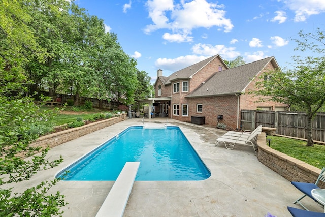 view of pool with a patio, a fenced in pool, and a fenced backyard