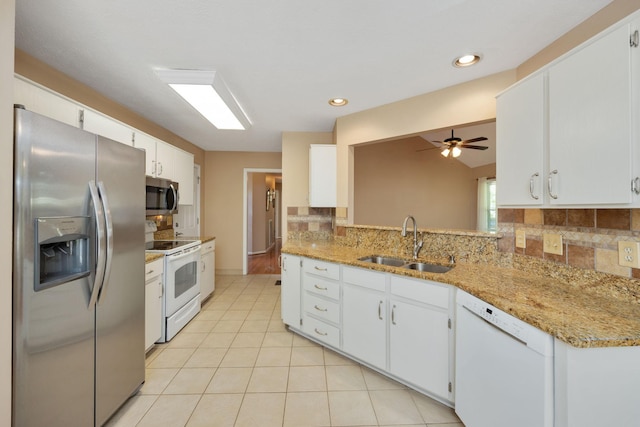 2004 Pinewood Ct, Mount Juliet, TN 37122 - kitchen featuring stainless steel appliances, a sink, backsplash, a ceiling fan, and recessed lighting
