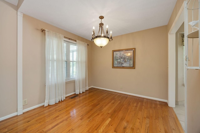 2004 Pinewood Ct, Mount Juliet, TN 37122 - spare room with a chandelier, light wood finished floors, and baseboards