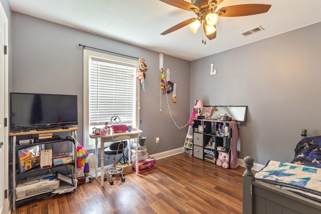 playroom featuring a ceiling fan, baseboards, visible vents, and wood finished floors