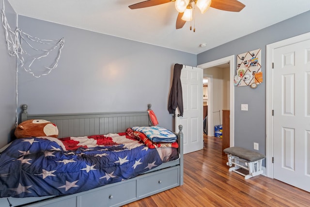 bedroom featuring ceiling fan and wood finished floors