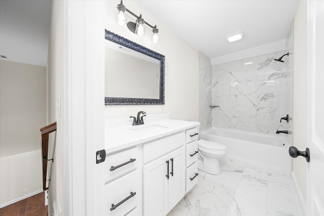 bathroom with toilet, marble finish floor, vanity, and shower / washtub combination