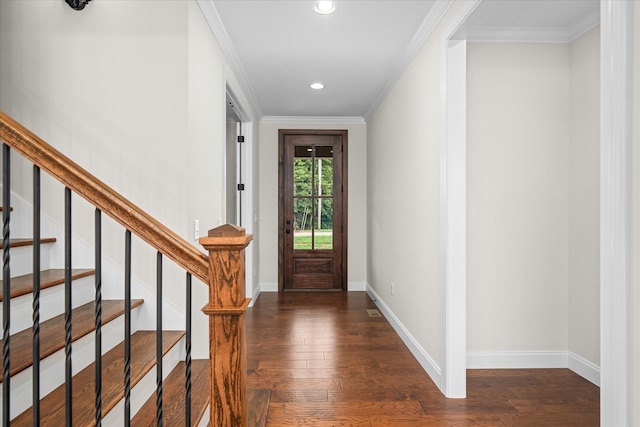 foyer featuring ornamental molding, wood-type flooring, baseboards, and recessed lighting