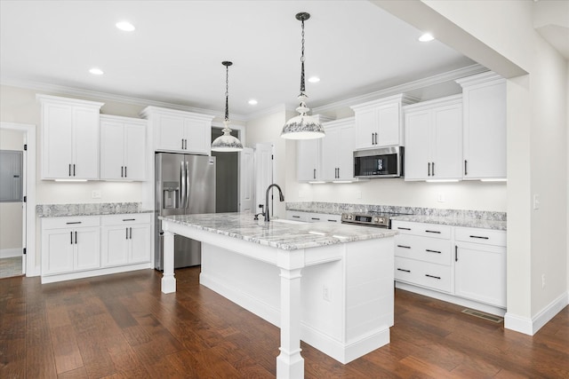 kitchen featuring dark wood finished floors, an island with sink, white cabinets, hanging light fixtures, and appliances with stainless steel finishes