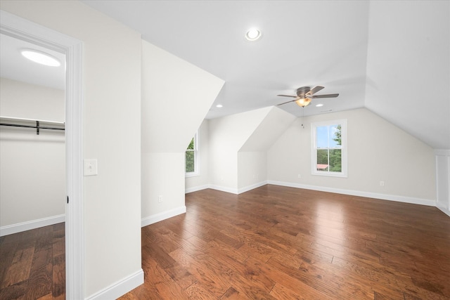 additional living space with wood finished floors, baseboards, ceiling fan, lofted ceiling, and recessed lighting