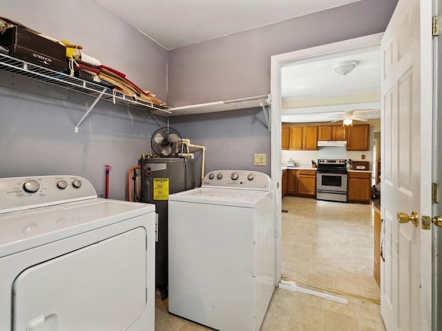 clothes washing area with laundry area, a ceiling fan, water heater, and washing machine and clothes dryer