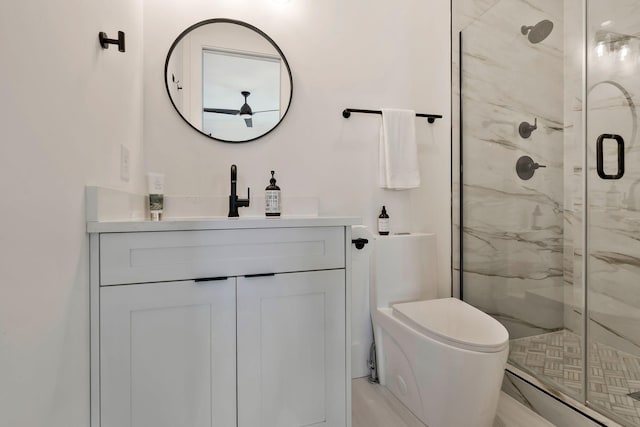 bathroom with vanity, toilet, and a marble finish shower