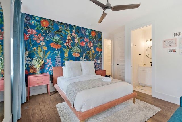 bedroom featuring a ceiling fan, baseboards, visible vents, connected bathroom, and wood finished floors