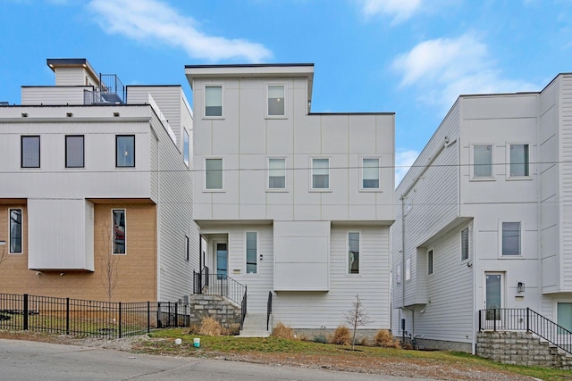 view of front of property with fence