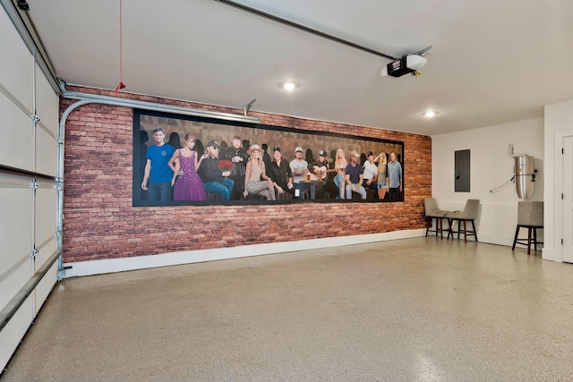 garage featuring electric panel, recessed lighting, baseboards, and a garage door opener