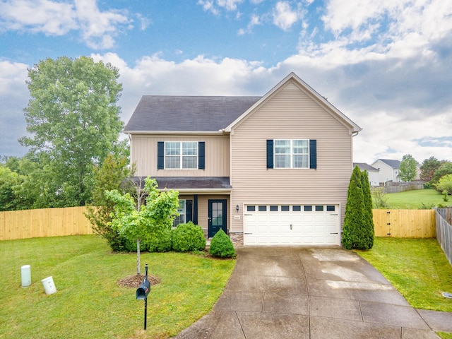 5002 Fox Run S, Spring Hill, TN 37174 - traditional-style home featuring fence, concrete driveway, a garage, a front lawn, and board and batten siding