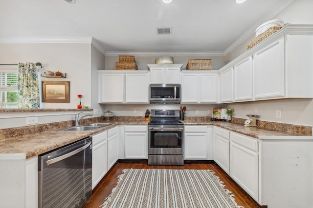 5002 Fox Run S, Spring Hill, TN 37174 - kitchen featuring a sink, stainless steel appliances, dark wood-type flooring, visible vents, and white cabinets
