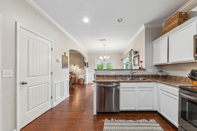 5002 Fox Run S, Spring Hill, TN 37174 - kitchen with arched walkways, stainless steel appliances, a peninsula, and crown molding