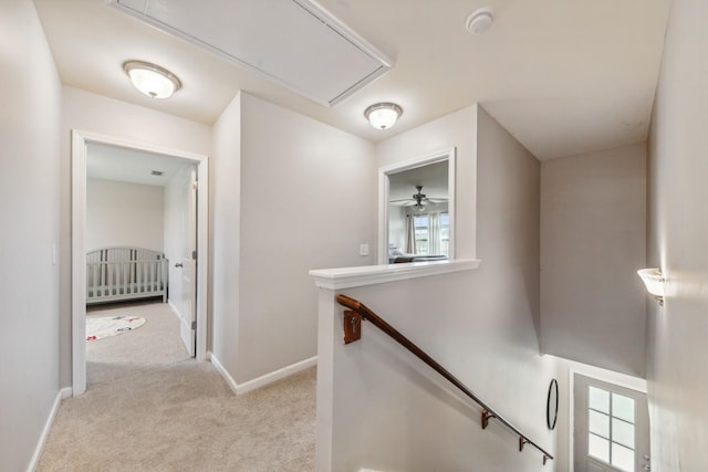 5002 Fox Run S, Spring Hill, TN 37174 - hall with baseboards, an upstairs landing, attic access, and carpet floors