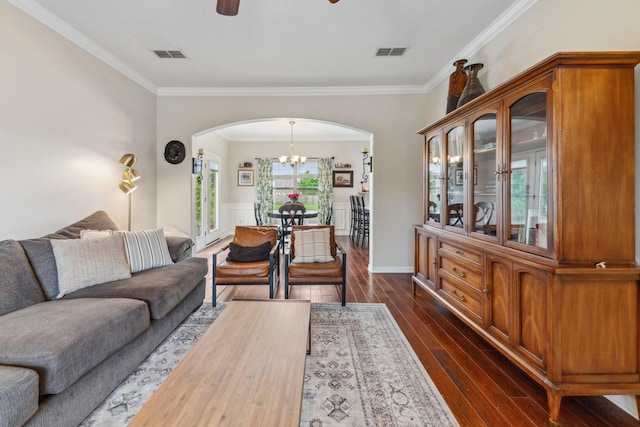 5002 Fox Run S, Spring Hill, TN 37174 - living room featuring arched walkways, ornamental molding, visible vents, and ceiling fan with notable chandelier