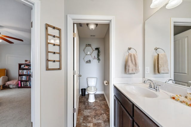 5002 Fox Run S, Spring Hill, TN 37174 - bathroom with toilet, a ceiling fan, stone finish flooring, baseboards, and vanity