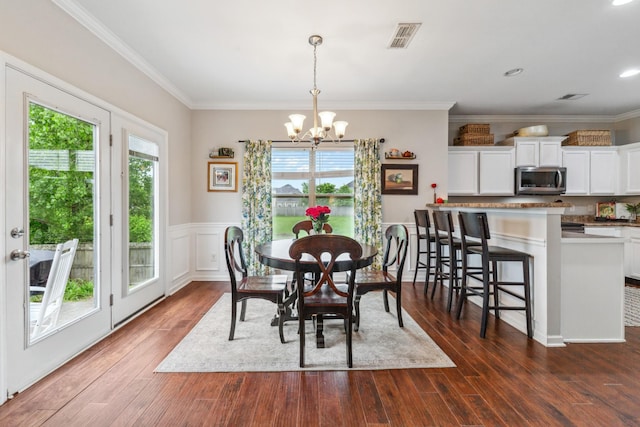 5002 Fox Run S, Spring Hill, TN 37174 - dining area featuring crown molding, a healthy amount of sunlight, a chandelier, and dark wood finished floors