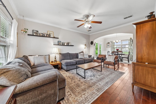 5002 Fox Run S, Spring Hill, TN 37174 - living area with ornamental molding, visible vents, ceiling fan with notable chandelier, hardwood / wood-style flooring, and arched walkways