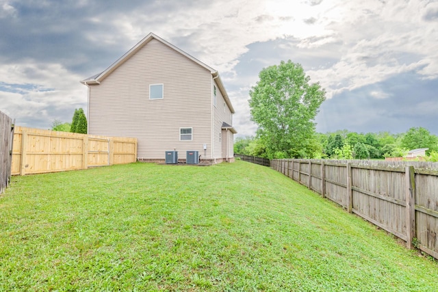 5002 Fox Run S, Spring Hill, TN 37174 - back of house featuring a lawn, cooling unit, and a fenced backyard