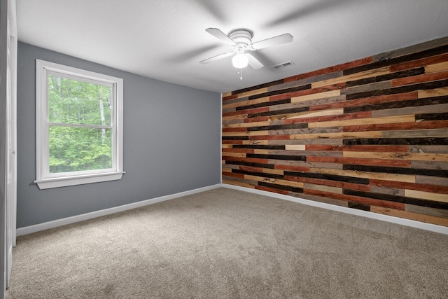 455 No Pone Valley Rd NW, Georgetown, TN 37336 - carpeted empty room featuring a ceiling fan, wood walls, baseboards, and visible vents