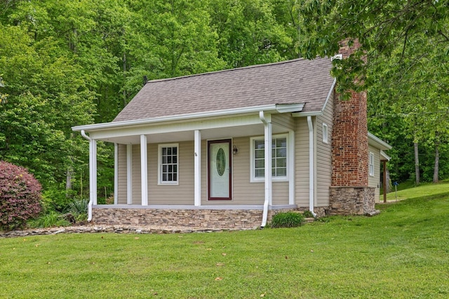 455 No Pone Valley Rd NW, Georgetown, TN 37336 - bungalow-style house featuring a chimney, covered porch, a shingled roof, and a front lawn