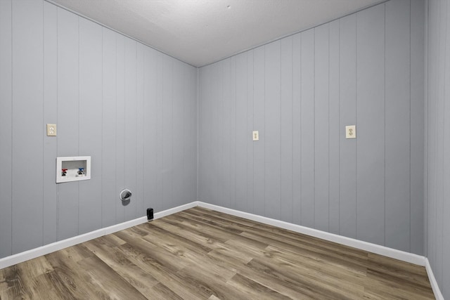 455 No Pone Valley Rd NW, Georgetown, TN 37336 - clothes washing area with wood finished floors, laundry area, washer hookup, a textured ceiling, and baseboards