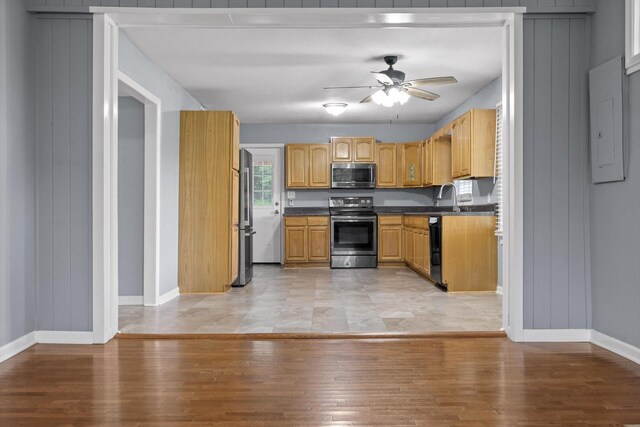 455 No Pone Valley Rd NW, Georgetown, TN 37336 - kitchen featuring ceiling fan, stainless steel appliances, dark countertops, and light wood-style flooring