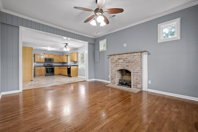 455 No Pone Valley Rd NW, Georgetown, TN 37336 - unfurnished living room featuring a ceiling fan, a brick fireplace, and light wood finished floors
