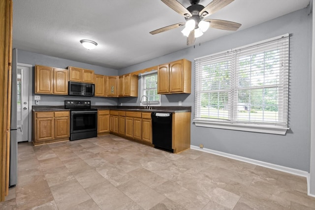 455 No Pone Valley Rd NW, Georgetown, TN 37336 - kitchen with a sink, dark countertops, baseboards, and black appliances