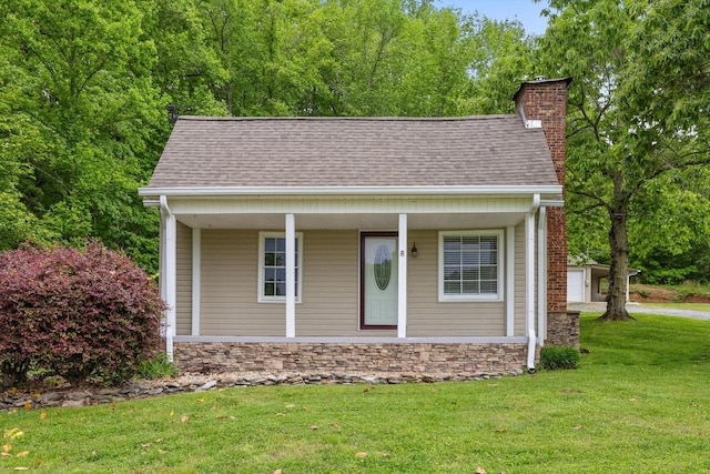 455 No Pone Valley Rd NW, Georgetown, TN 37336 - view of front of property with roof with shingles, a front lawn, and a chimney
