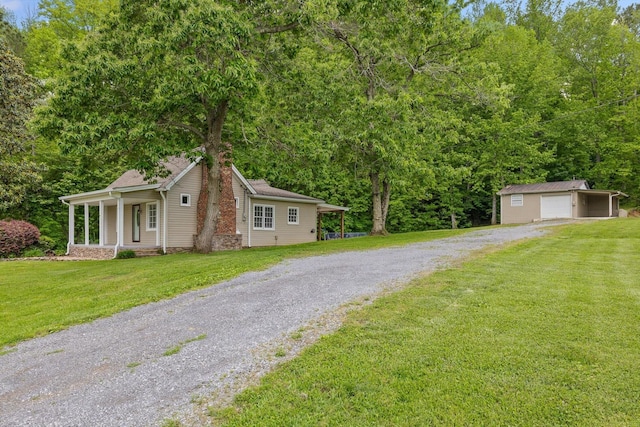 455 No Pone Valley Rd NW, Georgetown, TN 37336 - view of front of property featuring a front lawn, an outdoor structure, driveway, and a detached garage