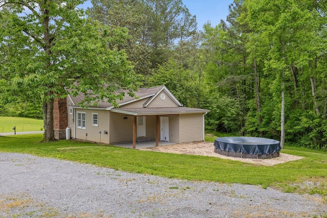 455 No Pone Valley Rd NW, Georgetown, TN 37336 - view of front facade with a chimney, a front yard, and an outdoor pool