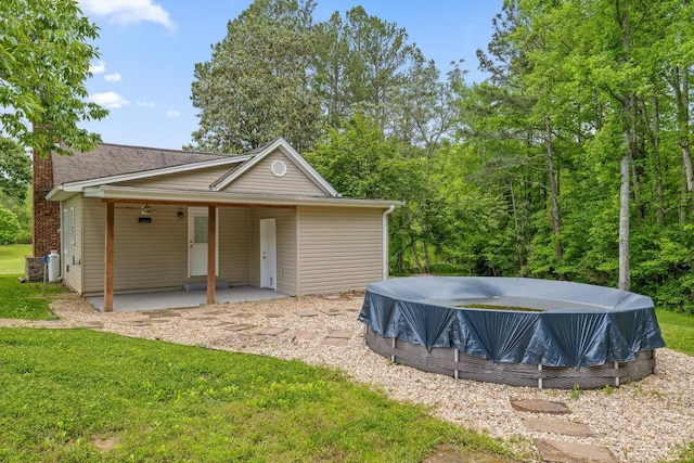455 No Pone Valley Rd NW, Georgetown, TN 37336 - rear view of house featuring a yard, a chimney, and a pool