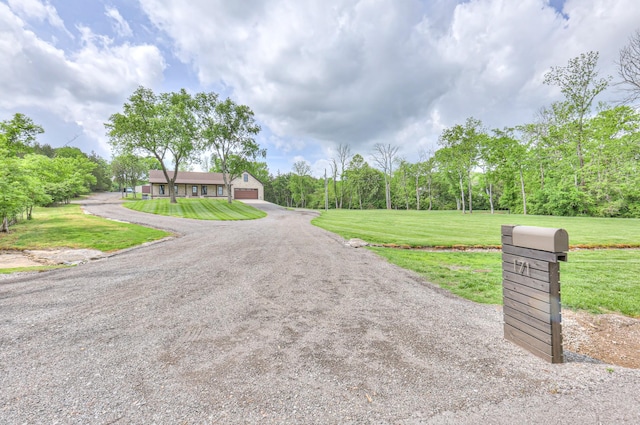 view of road featuring driveway