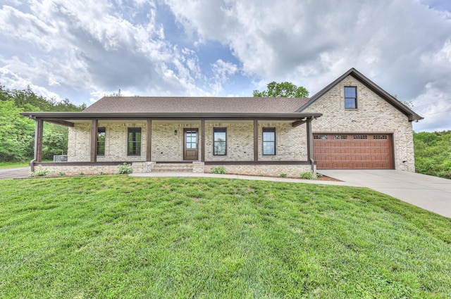 view of front of home featuring concrete driveway, a front yard, a porch, and brick siding