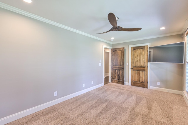 unfurnished bedroom with recessed lighting, crown molding, carpet floors, a ceiling fan, and baseboards