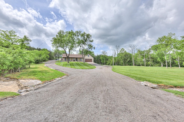 view of road featuring driveway