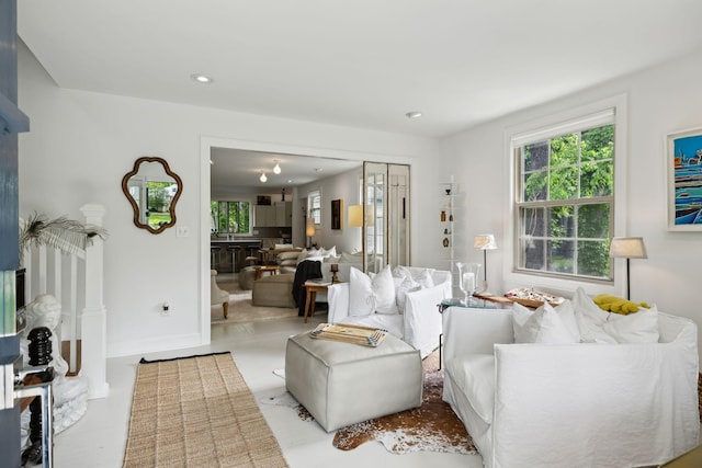 living room with a wealth of natural light and recessed lighting