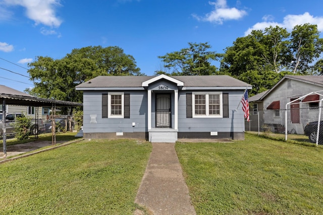 bungalow-style home featuring a front yard, fence, and crawl space