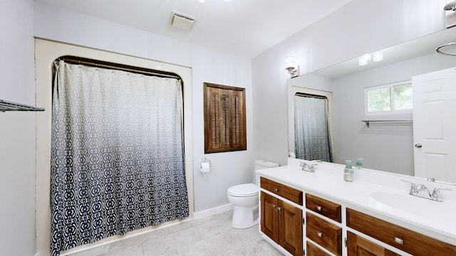 bathroom featuring double vanity, toilet, a sink, tile patterned floors, and visible vents