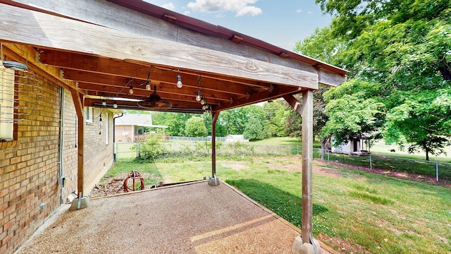 view of patio / terrace with a fenced backyard and a ceiling fan
