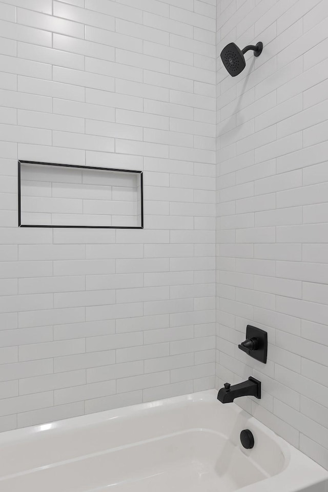bathroom featuring washtub / shower combination