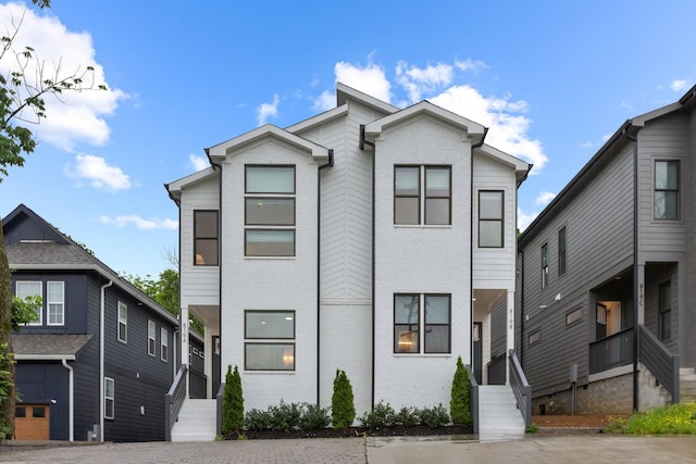 view of front of house featuring brick siding
