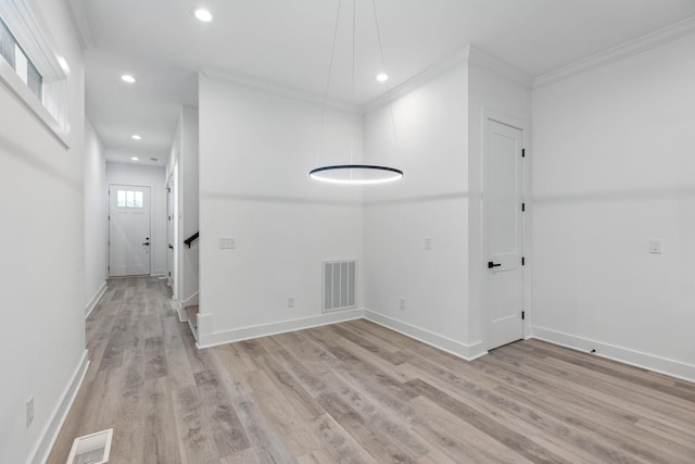 spare room featuring baseboards, recessed lighting, light wood-style floors, and visible vents