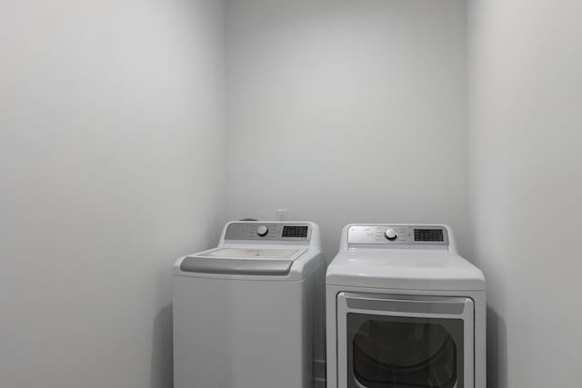 clothes washing area with laundry area and washing machine and dryer