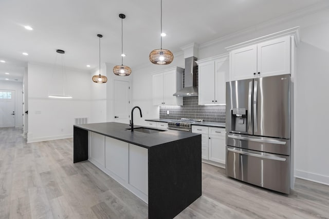 kitchen with a sink, dark countertops, stainless steel appliances, wall chimney range hood, and tasteful backsplash