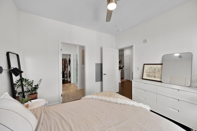 1677 54th Ave N Unit 318, Nashville, TN 37209 - bedroom featuring wood finished floors, a ceiling fan, and baseboards